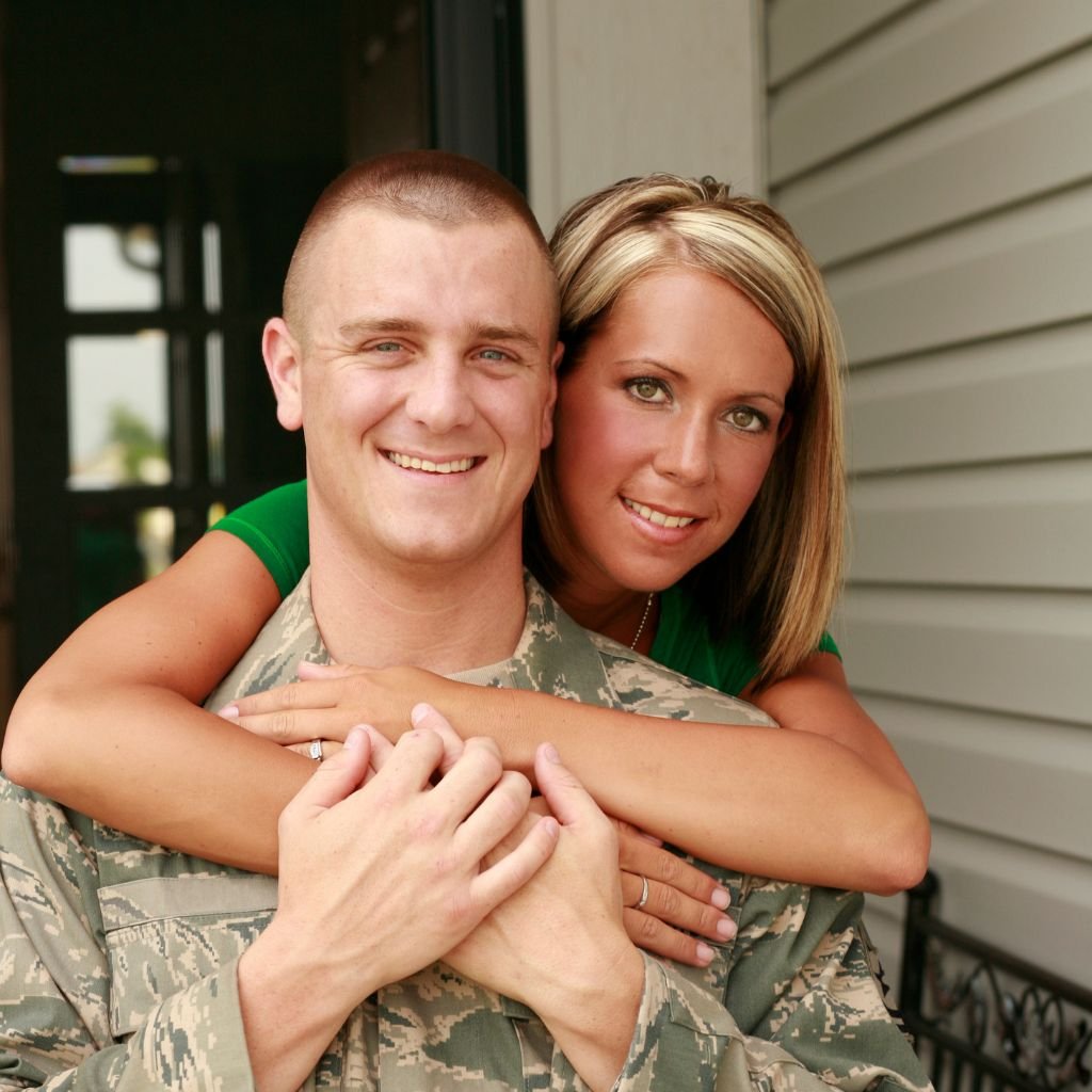 Spouse reviewing military records and DD214 paperwork